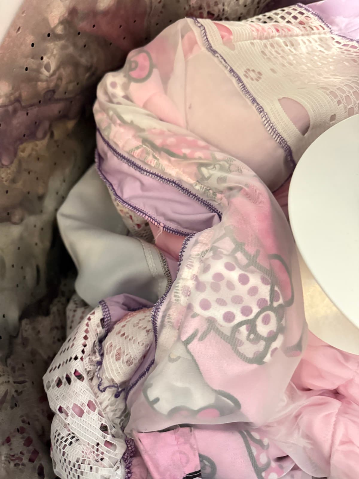 Close-up of a Kaosu piece's reclaimed fabric and lace trim
